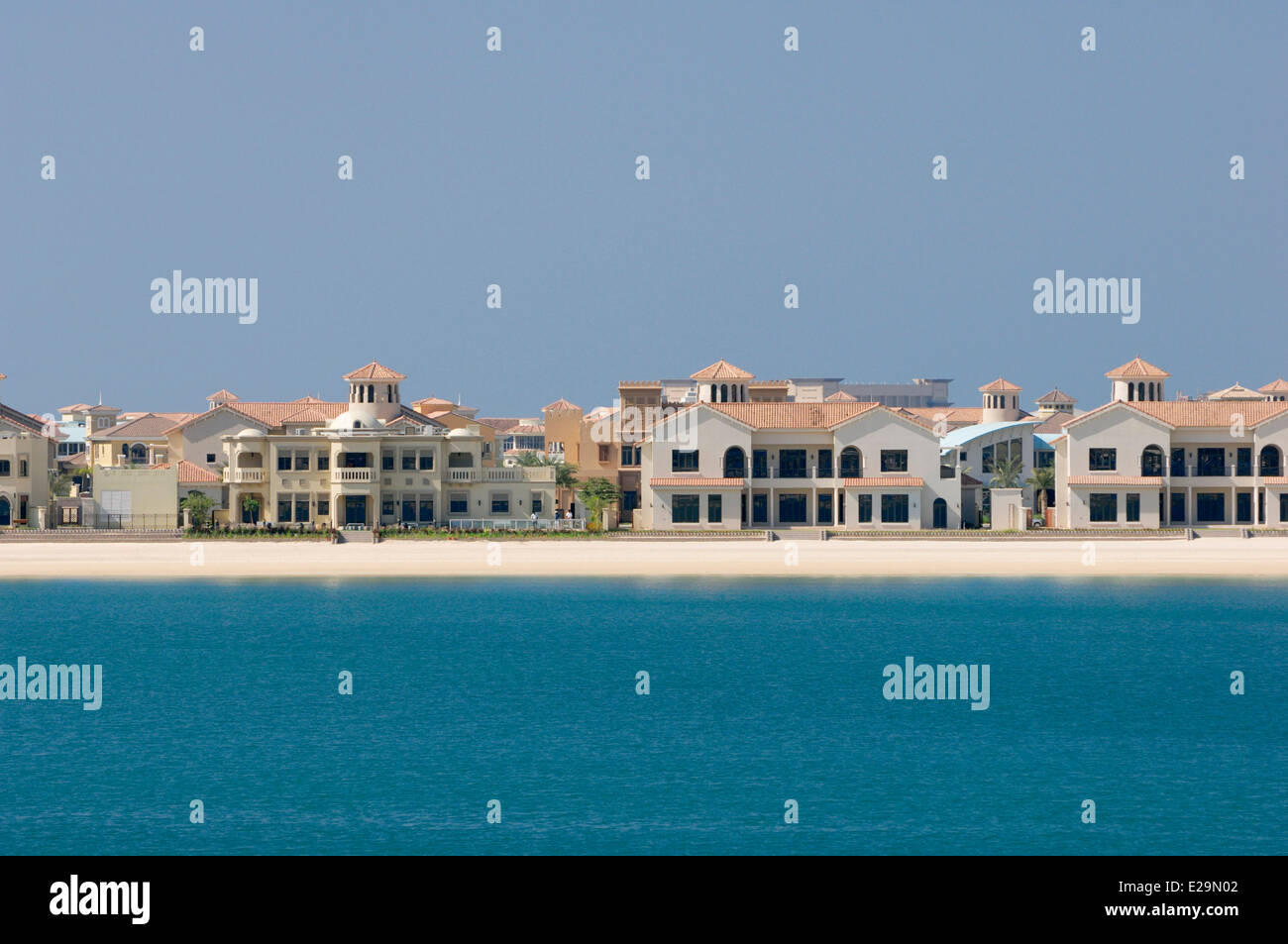 United Arab Emirates, Dubai emirate, Jumeirah, houses at the waterfront calles water homes on the artificial island palm shaped Stock Photo