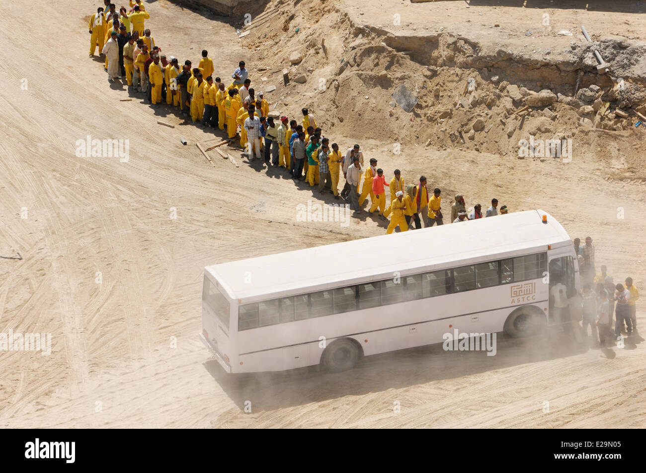 United Arab Emirates, Dubai emirate, Jumeirah, Indian workers riding in a bus on the construction site buildings of Jumeirah Stock Photo