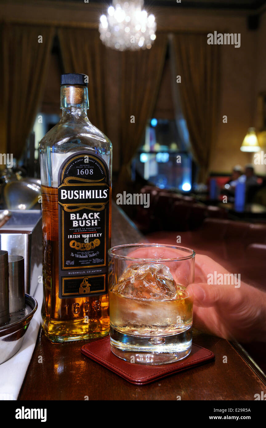 United Kingdom, Northern Ireland, Belfast, The Merchant Hotel bar in a former bank, bottle of Bushmills whiskey Stock Photo