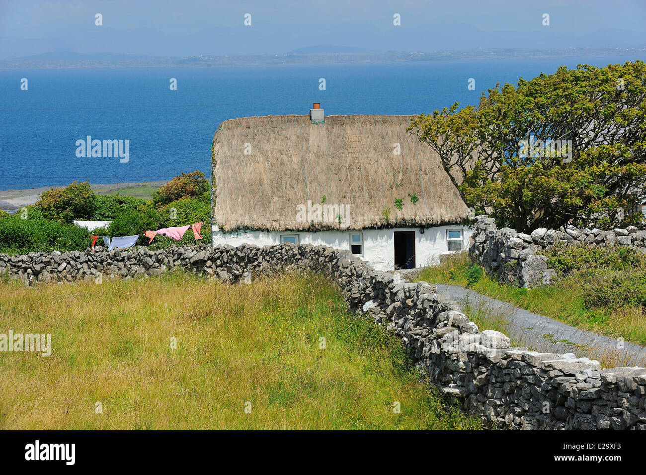 Ireland, County Galway, Aran Islands, Inishmore, Thatched Cottage Stock Photo