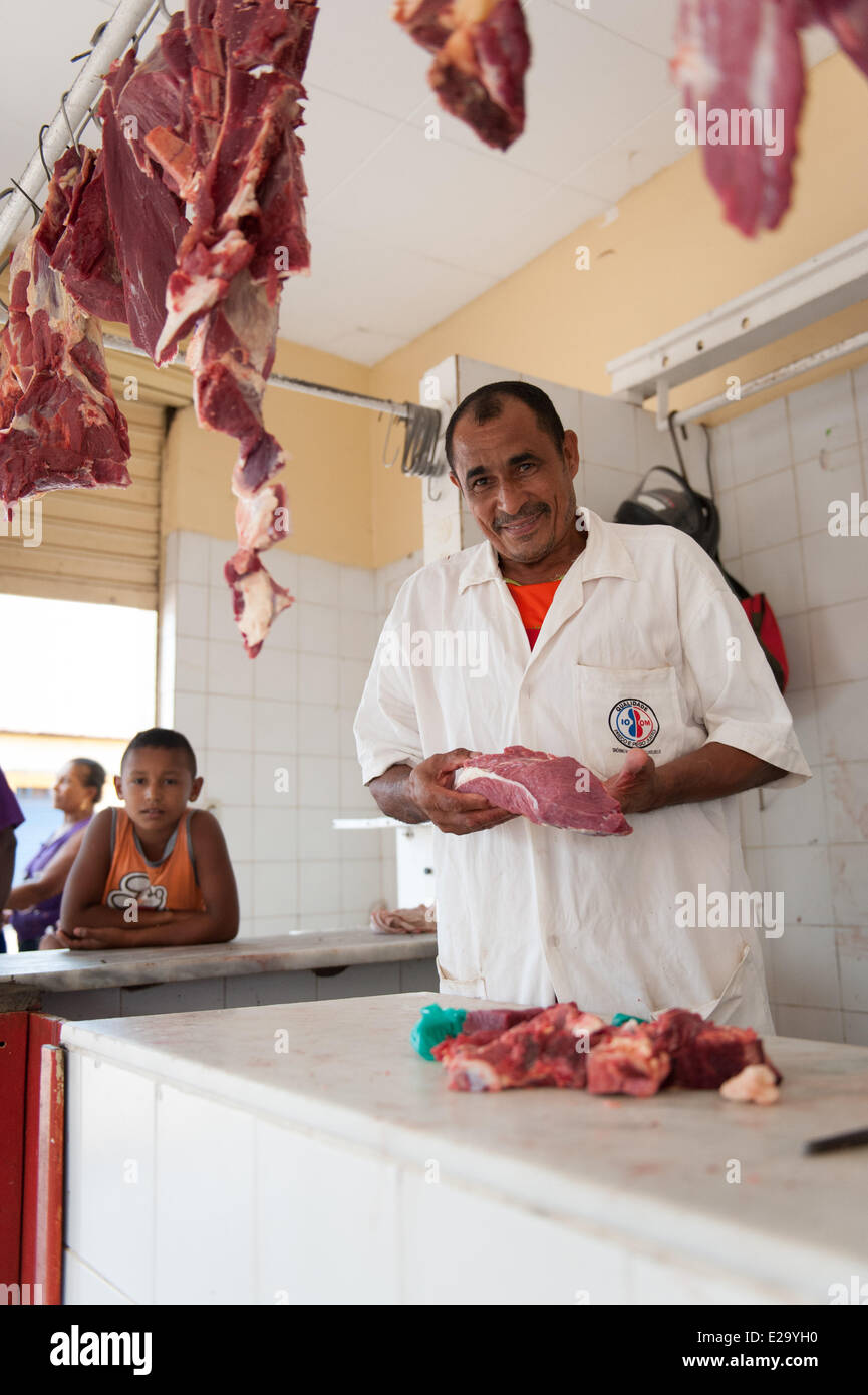 Butcher at marketplace. - Streets, villages and people in Codó, Maranhao, in Brazil's north. Stock Photo