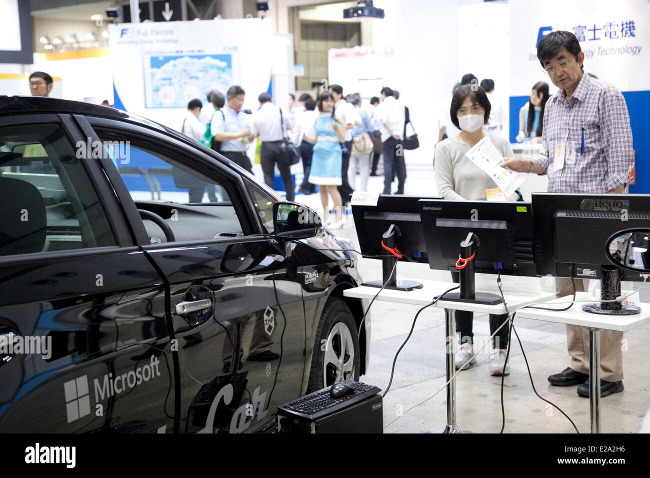 Tokyo, Japan. 18th June, 2014. – Visitors sees the ZMP 'RoboCar' at the Smart Community Japan 2014 in Tokyo Big Sight on June 18, 2014. The exhibition brings the latests products and technologies divided in 5 categories, 'Smart Community Exhibition', 'Biomass Expo', 'Next Generation Vehicle Exhibition, and newly-created 'Community Cloud 2014', which introduces technology for urban development. This year 229 enterprises and organizations shows their products from June 18th to 20th. Credit:  Aflo Co. Ltd./Alamy Live News Stock Photo