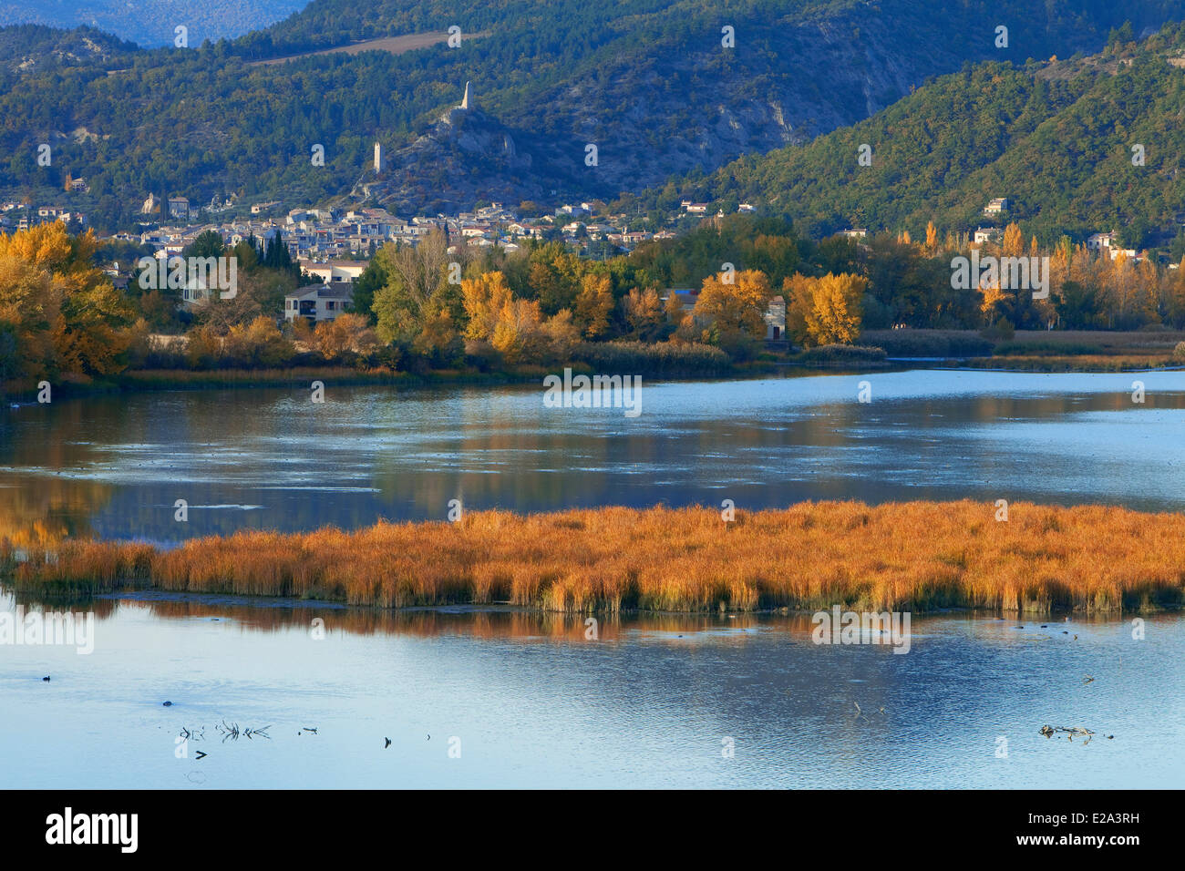 France, Alpes de Haute Provence, L'Escale, the lake, the village of Volonne in the background Stock Photo