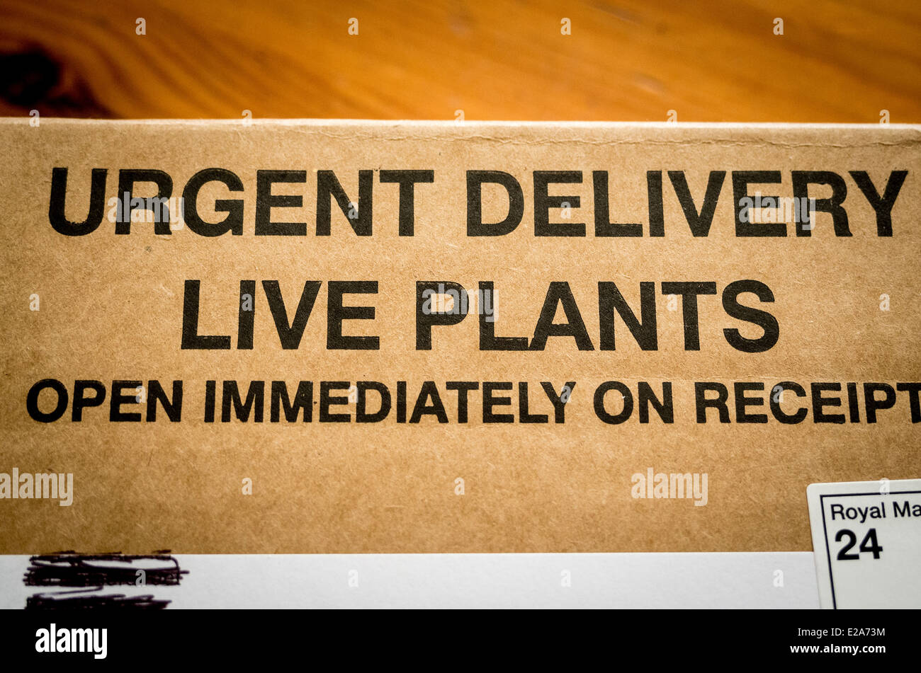 Package with urgent warning of action to take on receipt of living plants Stock Photo