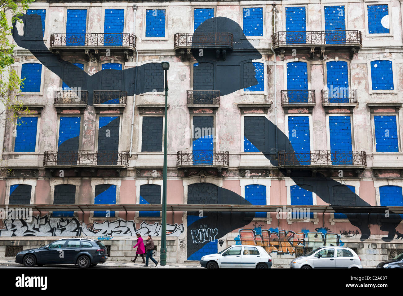 Portugal, Lisbon, the italien artist BLU joined with the bresilian Os Gemeos to realize a gigantic fresco Stock Photo