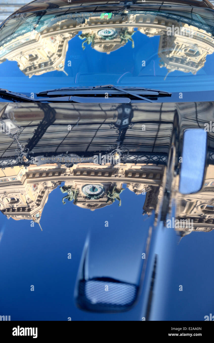 Principality of Monaco, Monaco, Societe des Bains de Mer de Monaco, the Casino reflecting off the hood of a luxury car, Stock Photo