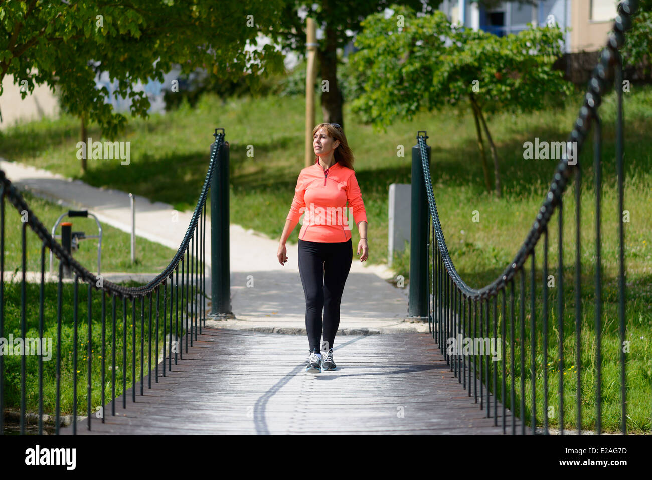 Woman power walking in a park Stock Photo