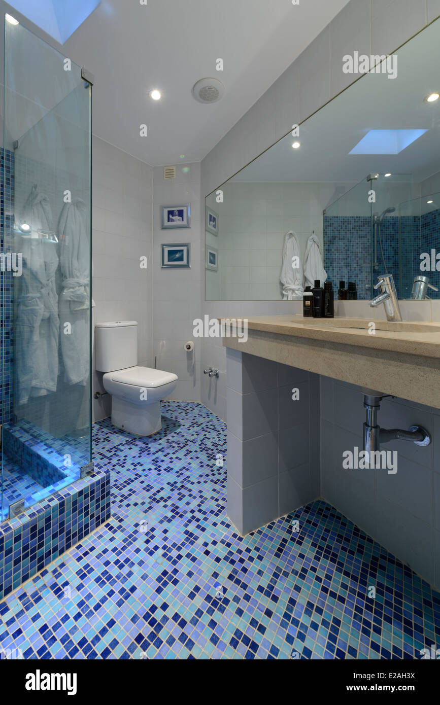 Modern bathroom with blue tiles Stock Photo