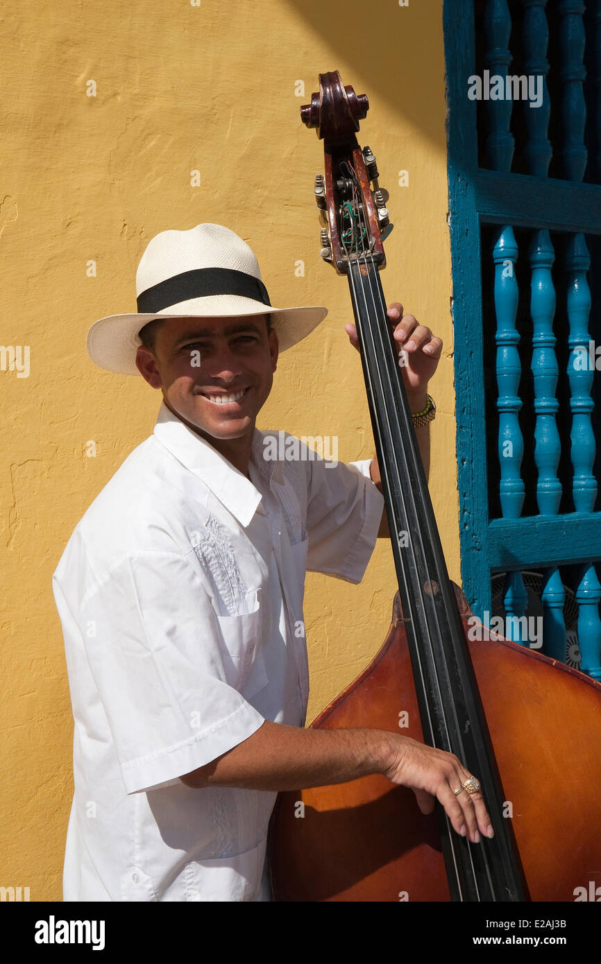 Cuba, Sancti Spiritus Province, Trinidad de Cuba, listed as World Heritage by UNESCO, a double bass player playing by a Stock Photo