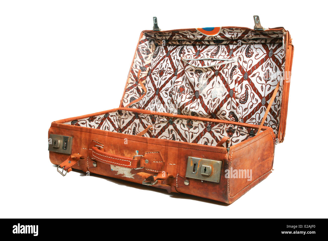Open leather suitcase with batik cotton lining Stock Photo
