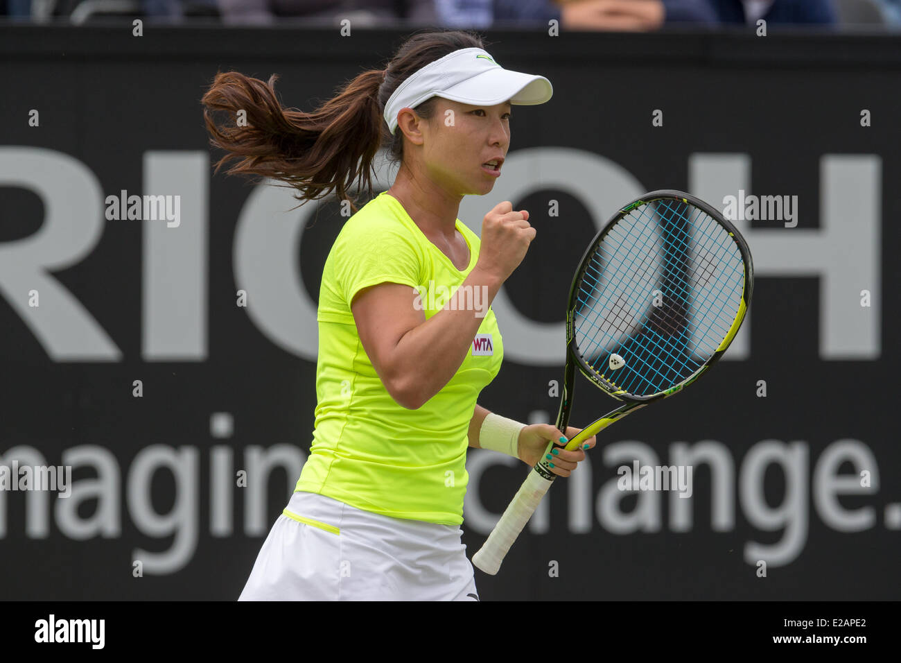 Rosmalen, The Netherlands. 18th June, 2014. Chinese tennis player Jie Zheng reacts during the 2nd round singles match of the Topshelf Open 2014 at Autotron, Rosmalen, Netherlands on 18.06.2014. She won against Carla Suarez Navarro (ESP) who had to retire at 7:5 0:1 due to back problems.  Credit:  Janine Lang/Alamy Live News Stock Photo