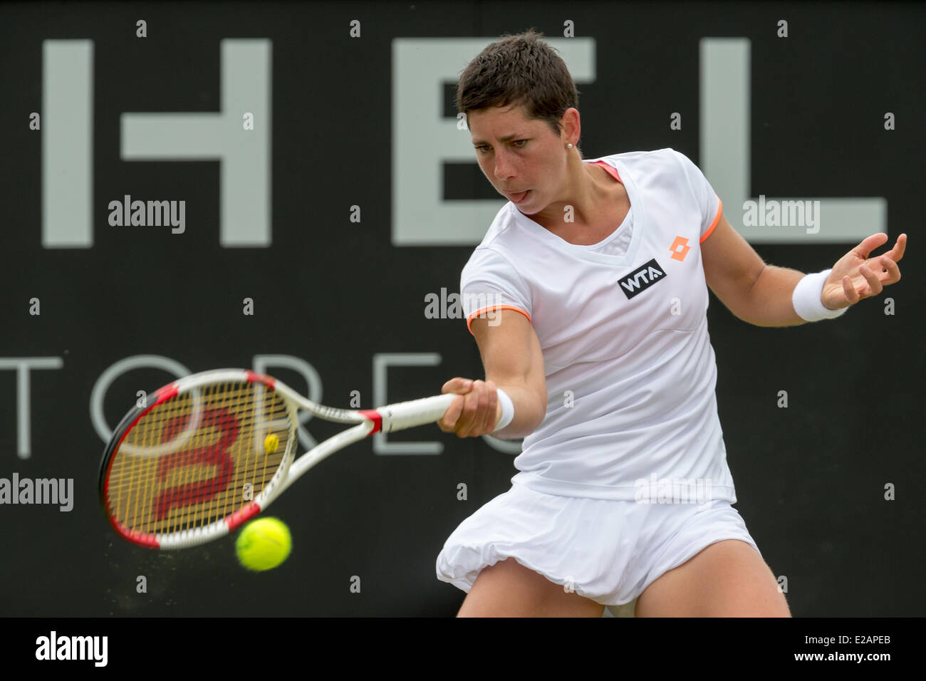 Tennis player Carla Suarez Navarro (ESP) hits a forehand during her 2nd round singles match of the Topshelf Open 2014 at Autotron, Rosmalen, Netherlands on 18.06.2014. She was playing against Jie Zheng from China. After losing the first set 5:7 and leading 1:0 in the 2nd, Suarez Navarro had to retire due to back problems. Photo: International-Sport-Photos Stock Photo