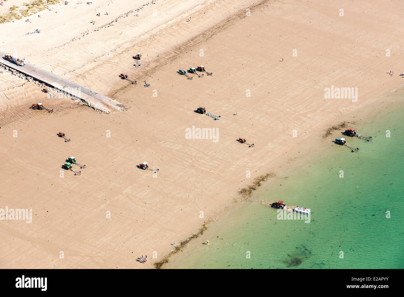 France, Manche, Cotentin, Gouville sur Mer, tractors with boat trail on the beach (aerial view) Stock Photo