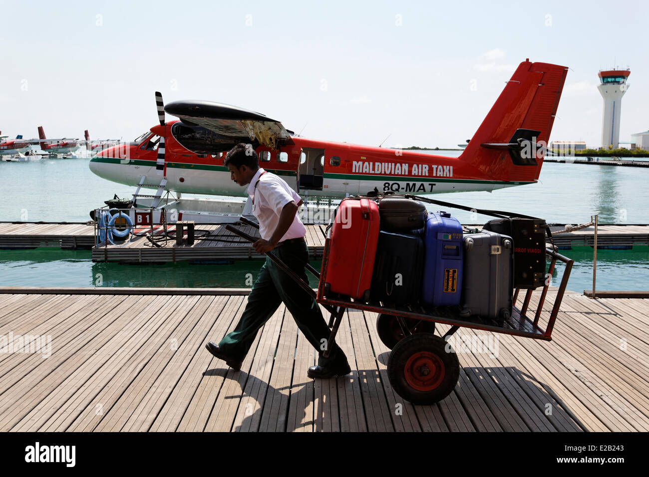 Maldives, North Male atoll, Male island, Male airport, boarding pontoon,  unloading luggage Stock Photo - Alamy
