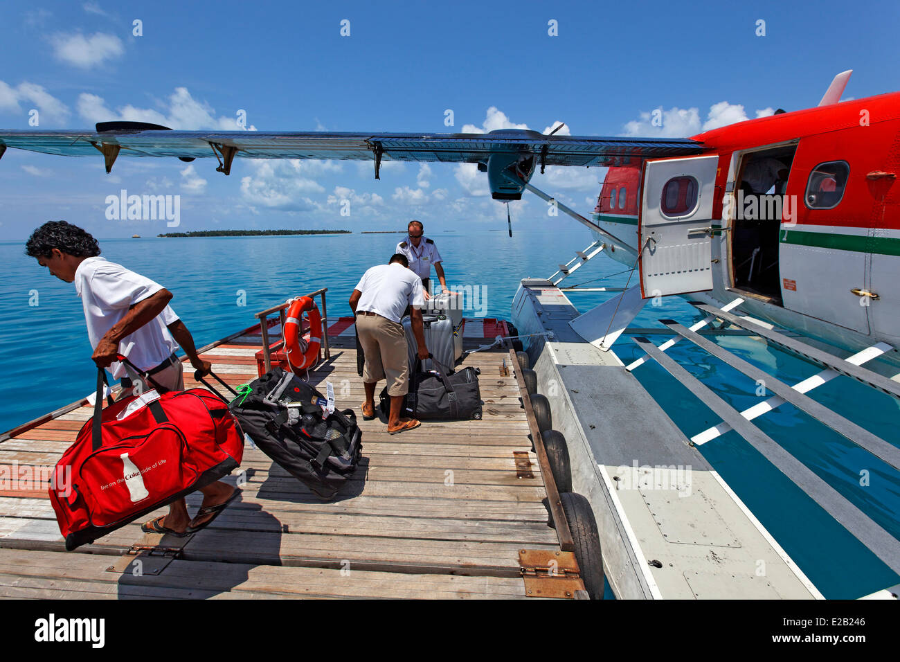 Maldives, seaplane of Maldivian Air Taxi company, unloading luggage Stock Photo