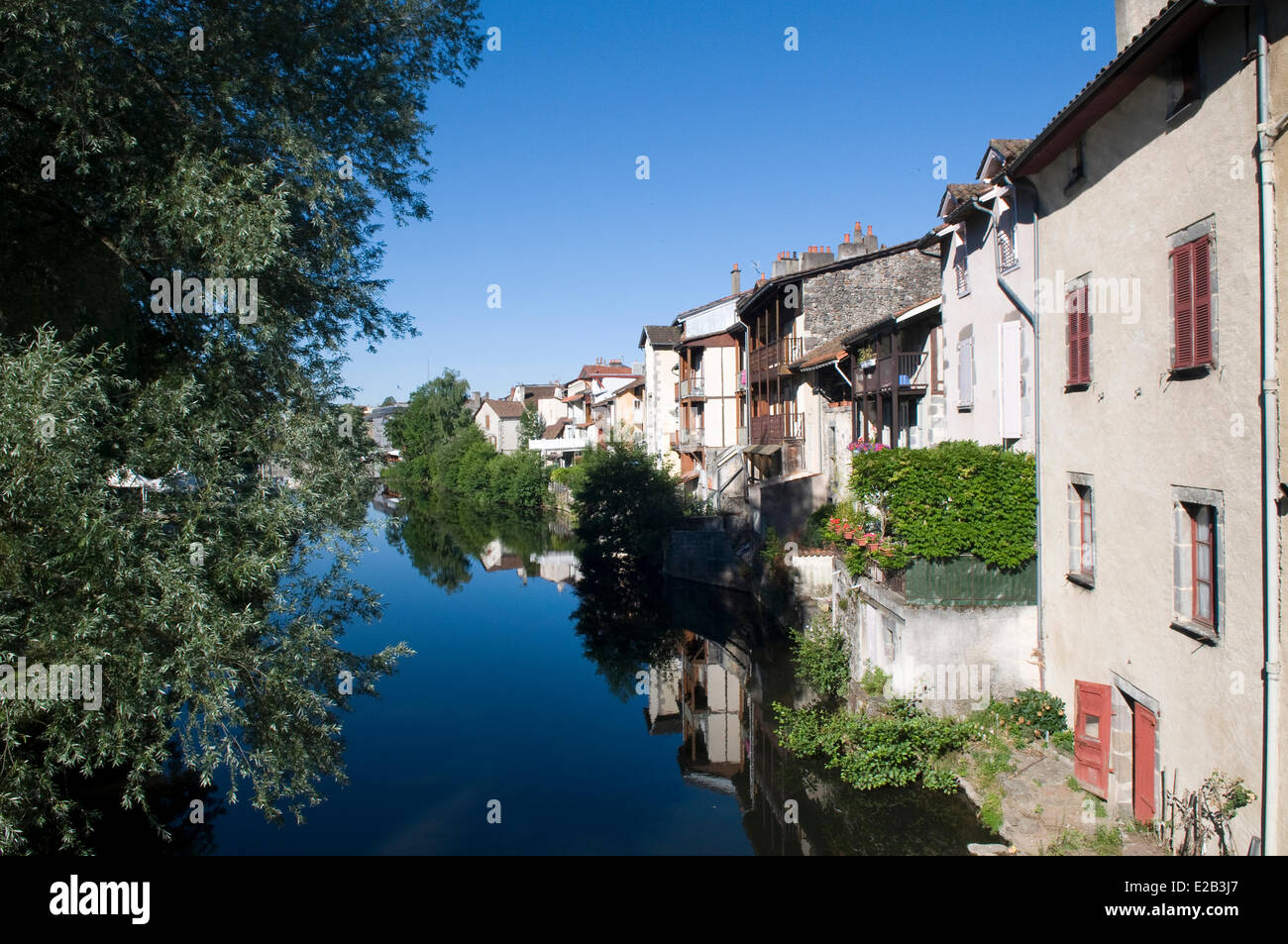 France, Cantal, Aurillac, houses on the edge of the Jordanne reflection in the river water Stock Photo