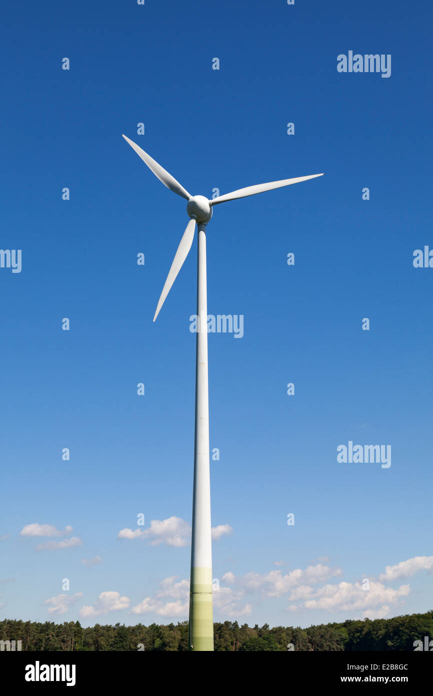 Wind turbine against bright blue sky Stock Photo - Alamy