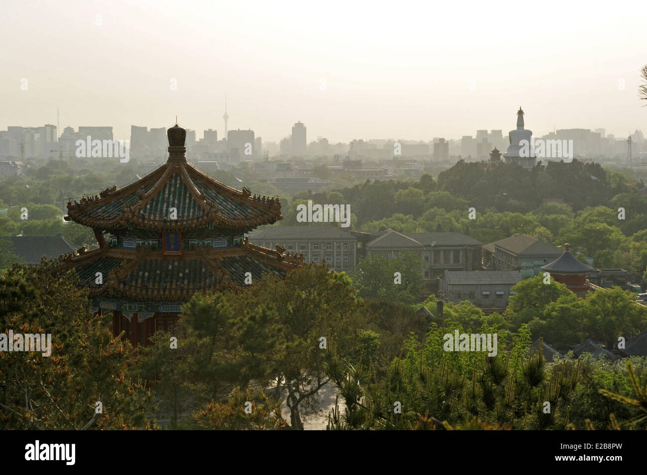 China, Beijing, temple in the Park of the Coal Hill and the white Dogoba in the Beihai park in the background Stock Photo