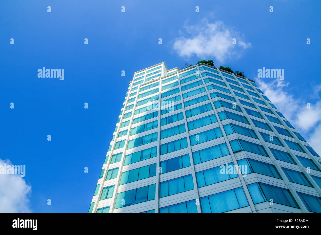 Building on blue sky background Stock Photo - Alamy