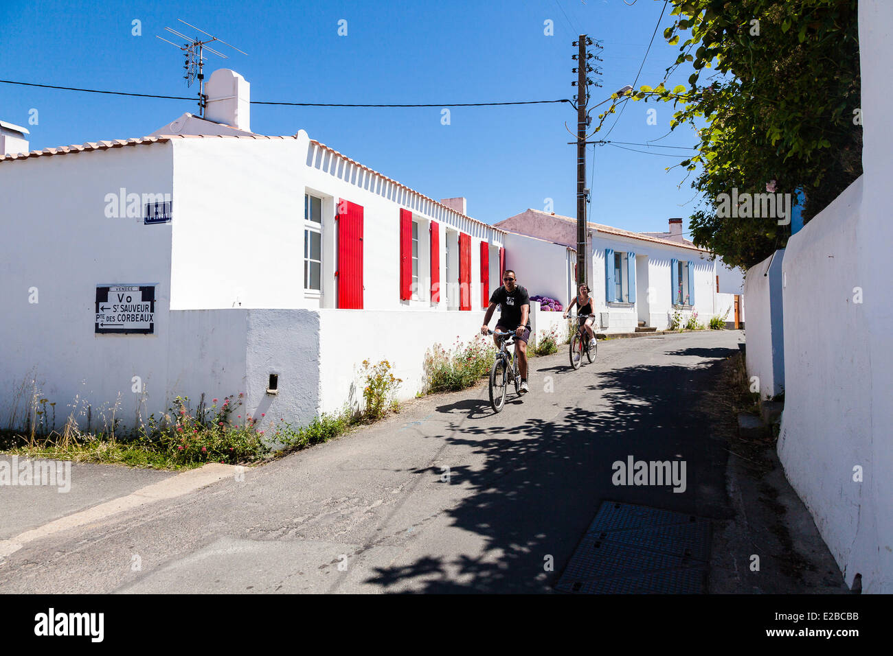 France, Vendee, Ile d'Yeu, cyclist in Port de la Meule Stock Photo