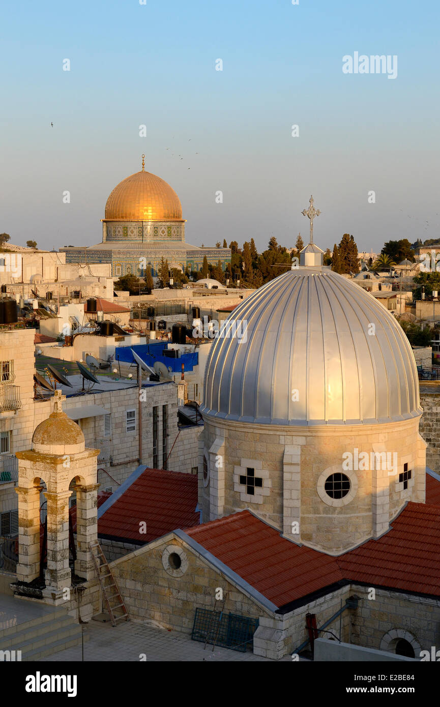 Israel, Jerusalem, holy city, the old town listed as World Heritage by UNESCO, the roofs of the Muslim Quarter, the church of Our Lady of the Spasm and the Dome of the Rock in the background Stock Photo
