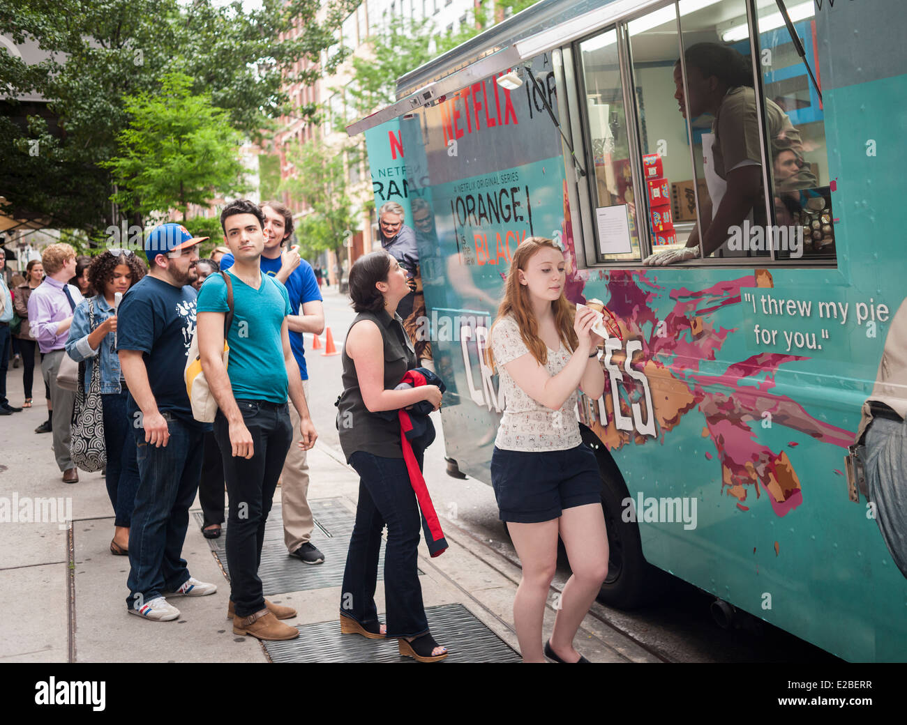 Fans of the Netflix series 'Orange is the New Black' line up at a rebranded food truck in Soho in New York Stock Photo