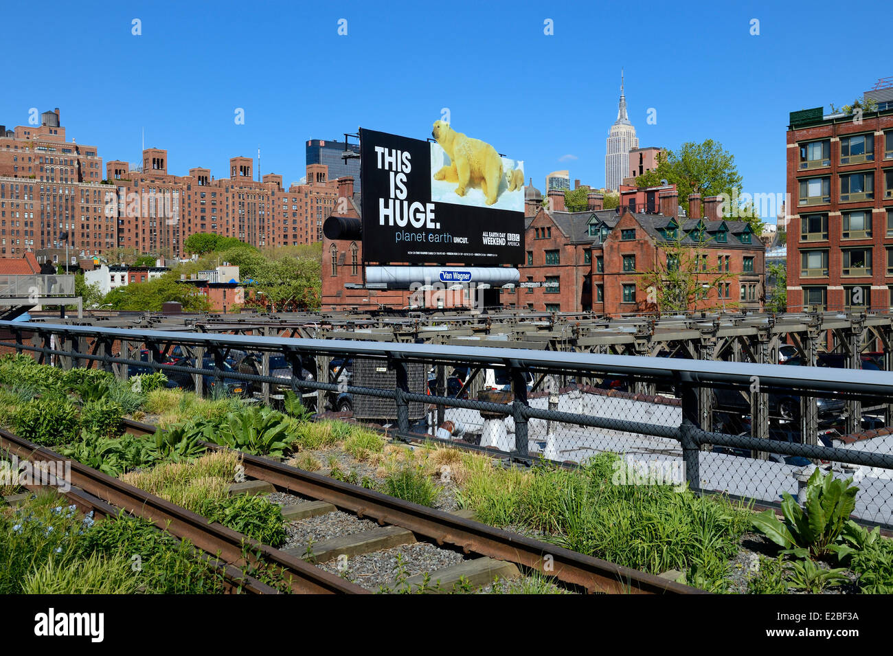 United States, New York City, Manhattan, Meatpacking District (Gansevoort Market), the High Line is a park built on a section of the former elevated freight railroad spur; the Empire State Building in the background Stock Photo