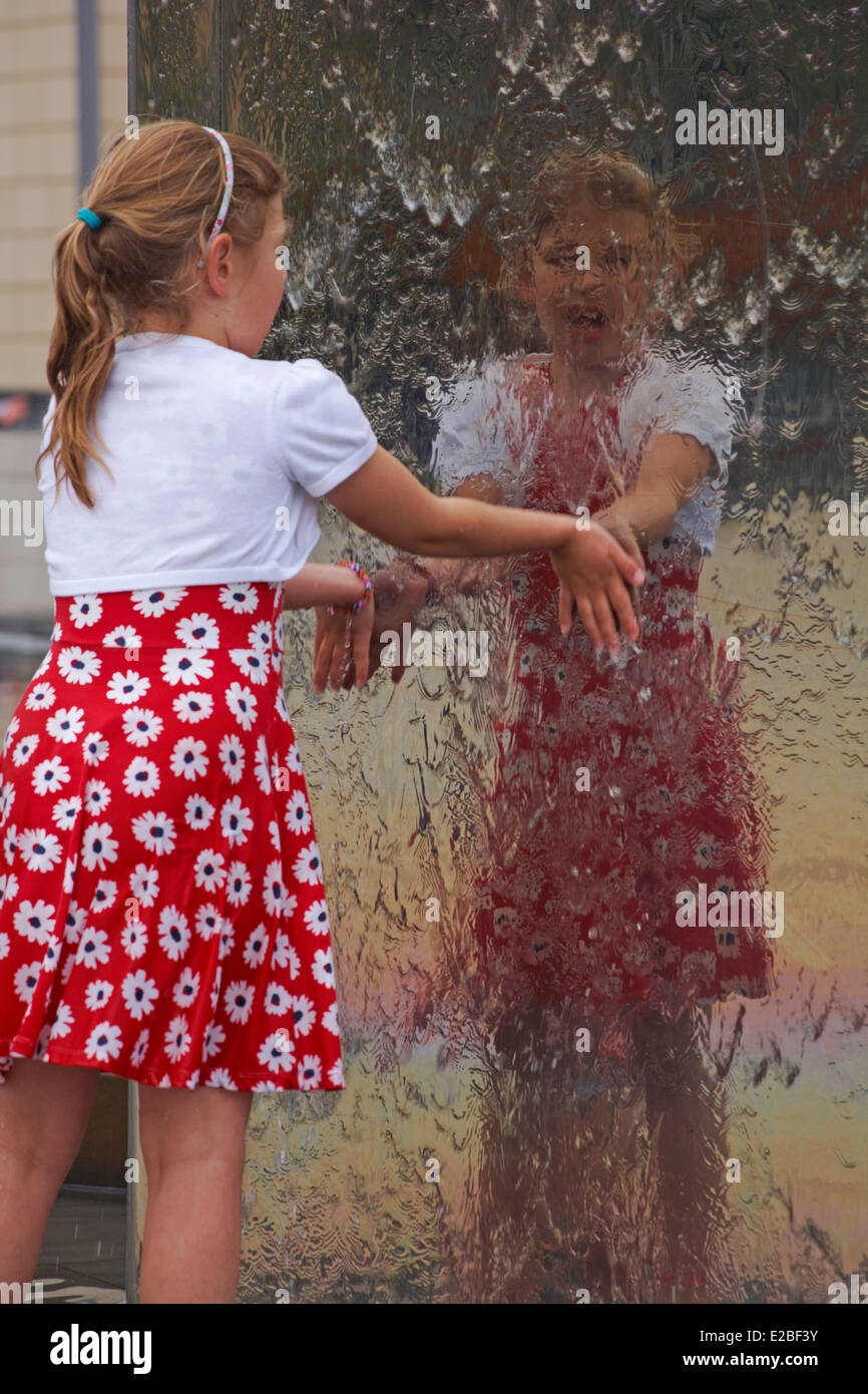enjoying the water girl playing in water fountains at Millenium