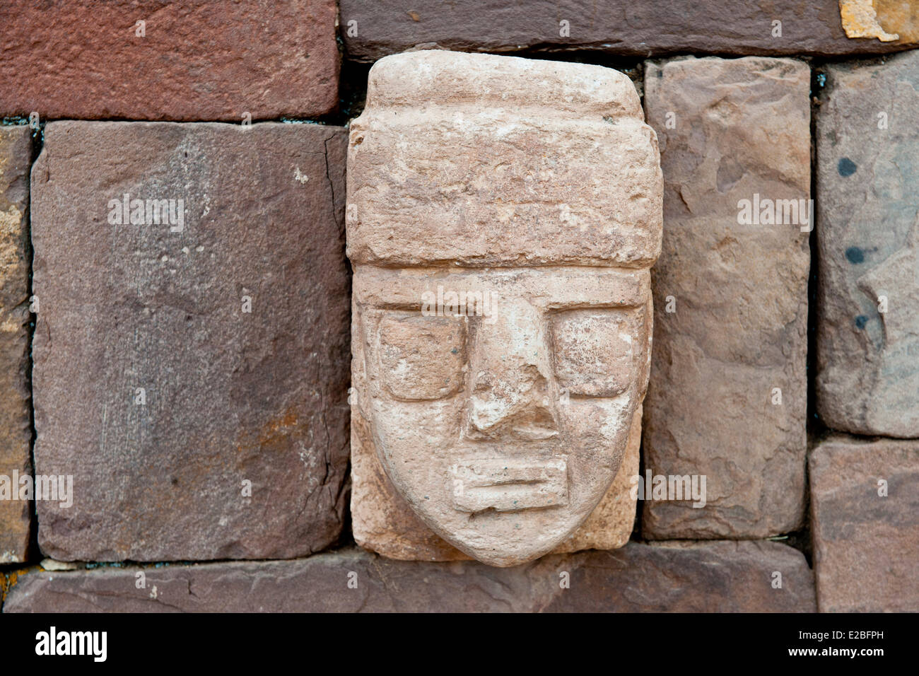 Bolivia, La Paz Department, Tiwanaku Pre-Inca archeological site, listed as World Heritage by UNESCO, carved stone head embedded in one of the walls of Tiwanaku semi-subterranean temple Stock Photo