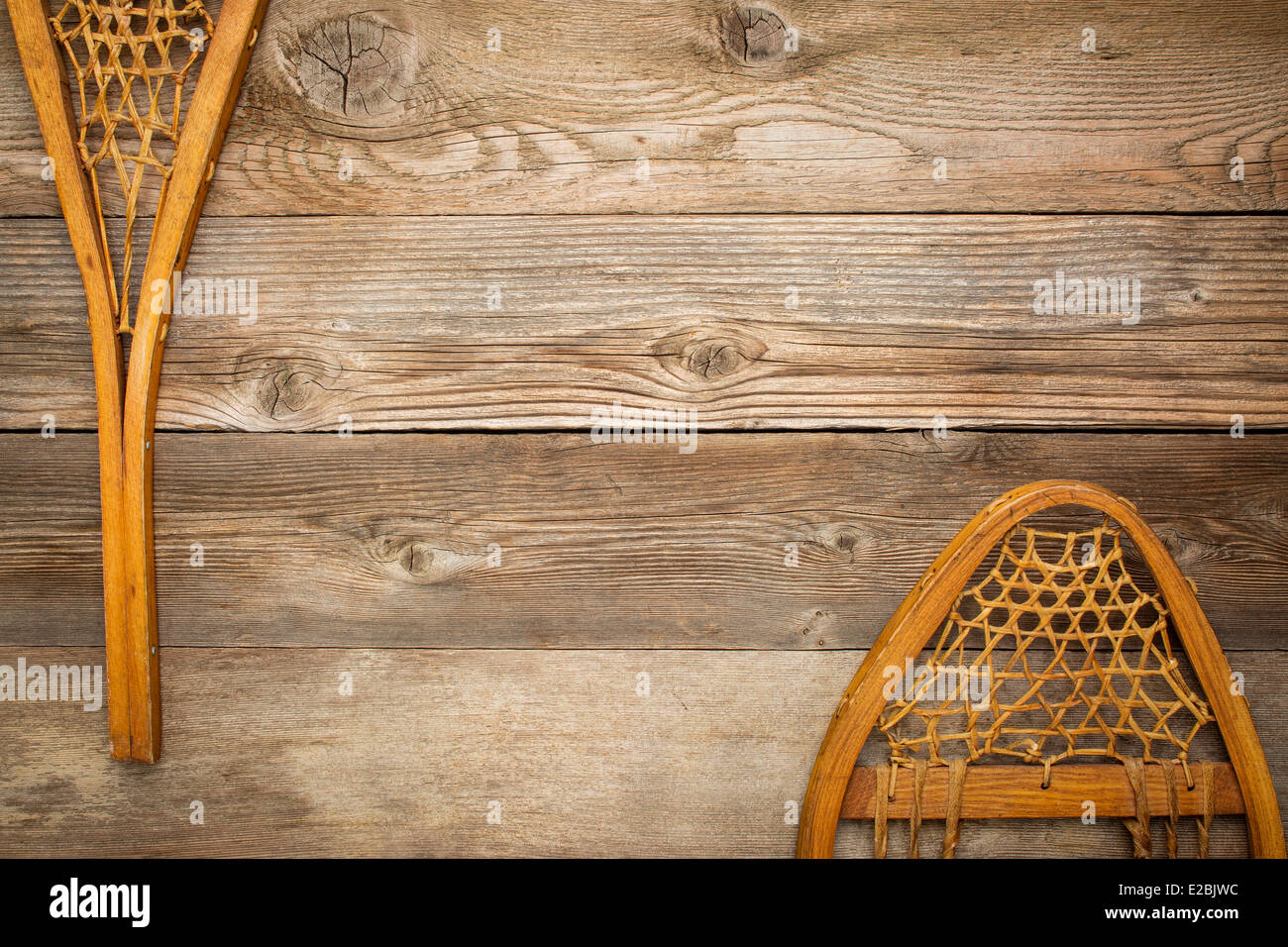 vintage Huron snowshoes against grained wood planks with a copy space Stock Photo