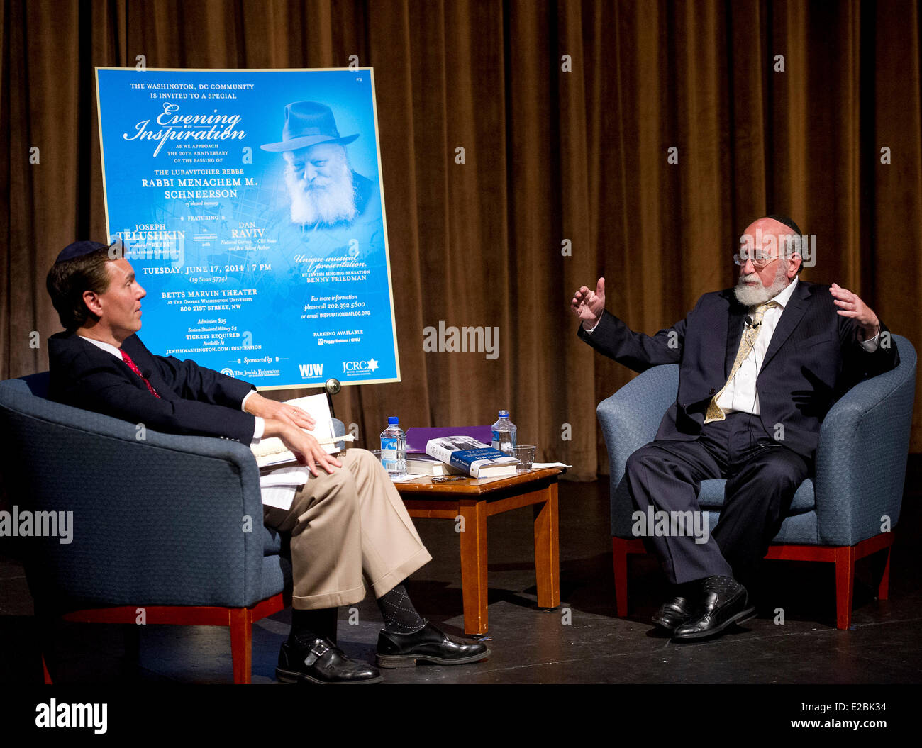 In honor of the approaching 20th anniversary of the passing of The Lubavitcher Rebbe, Rabbi Menachem M. Schneerson, of blessed memory, Joseph Telushkin, author of 'Rebbe', right, reviews his book in conversation his with CBS News National Correspondent and best selling author Dan Raviv, left, as part of a special Evening of Inspiration in the Betts Marvin Theatre on the camps of George Washington University in Washington, DC on Tuesday, June 17, 2014. The event which attracted hundreds was sponsored by the Jewish Federation of Greater Washington, The Jewish Community Relations Council, Washi Stock Photo