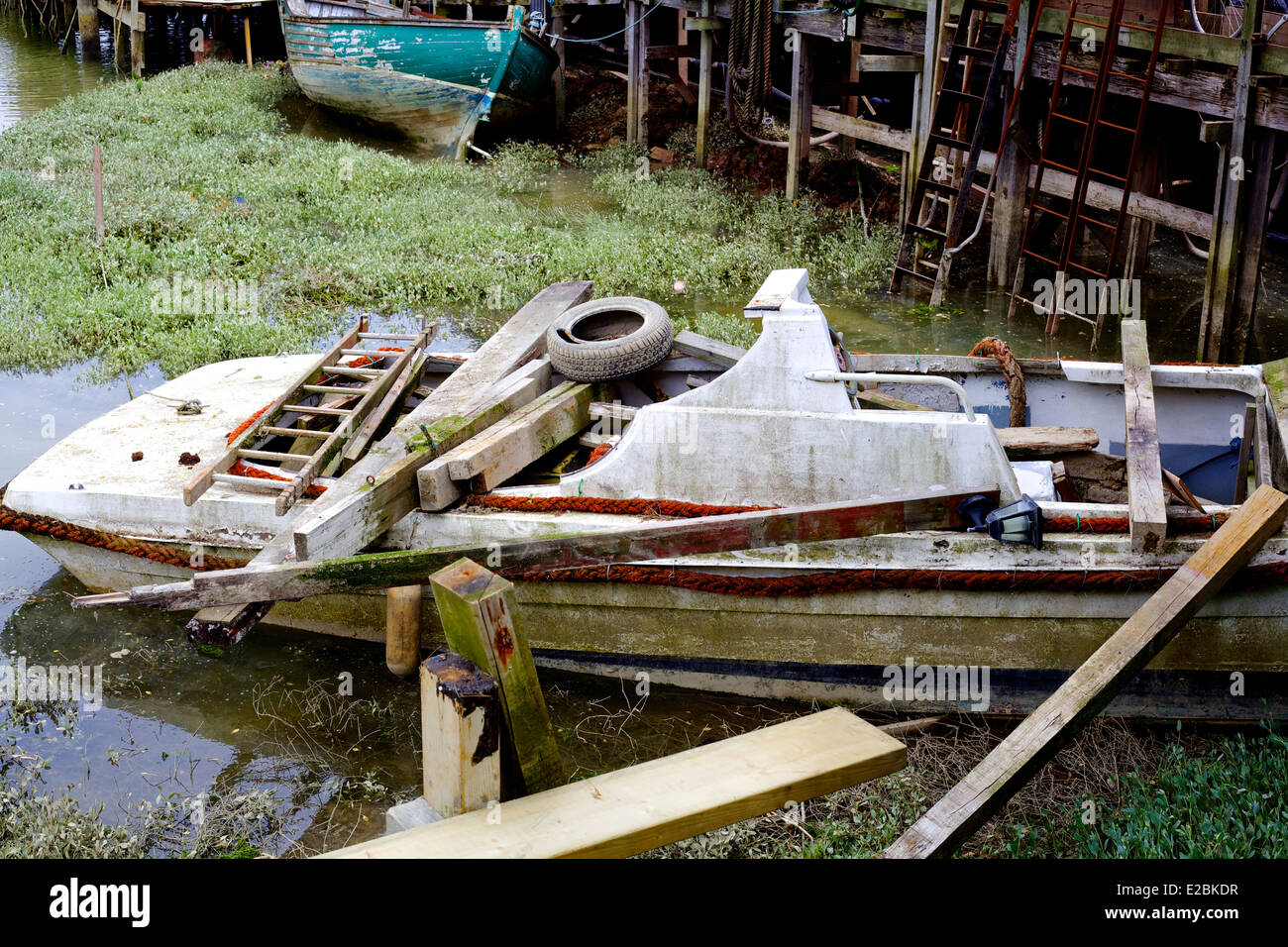 Sinking Boat with junk aboard Stock Photo Alamy