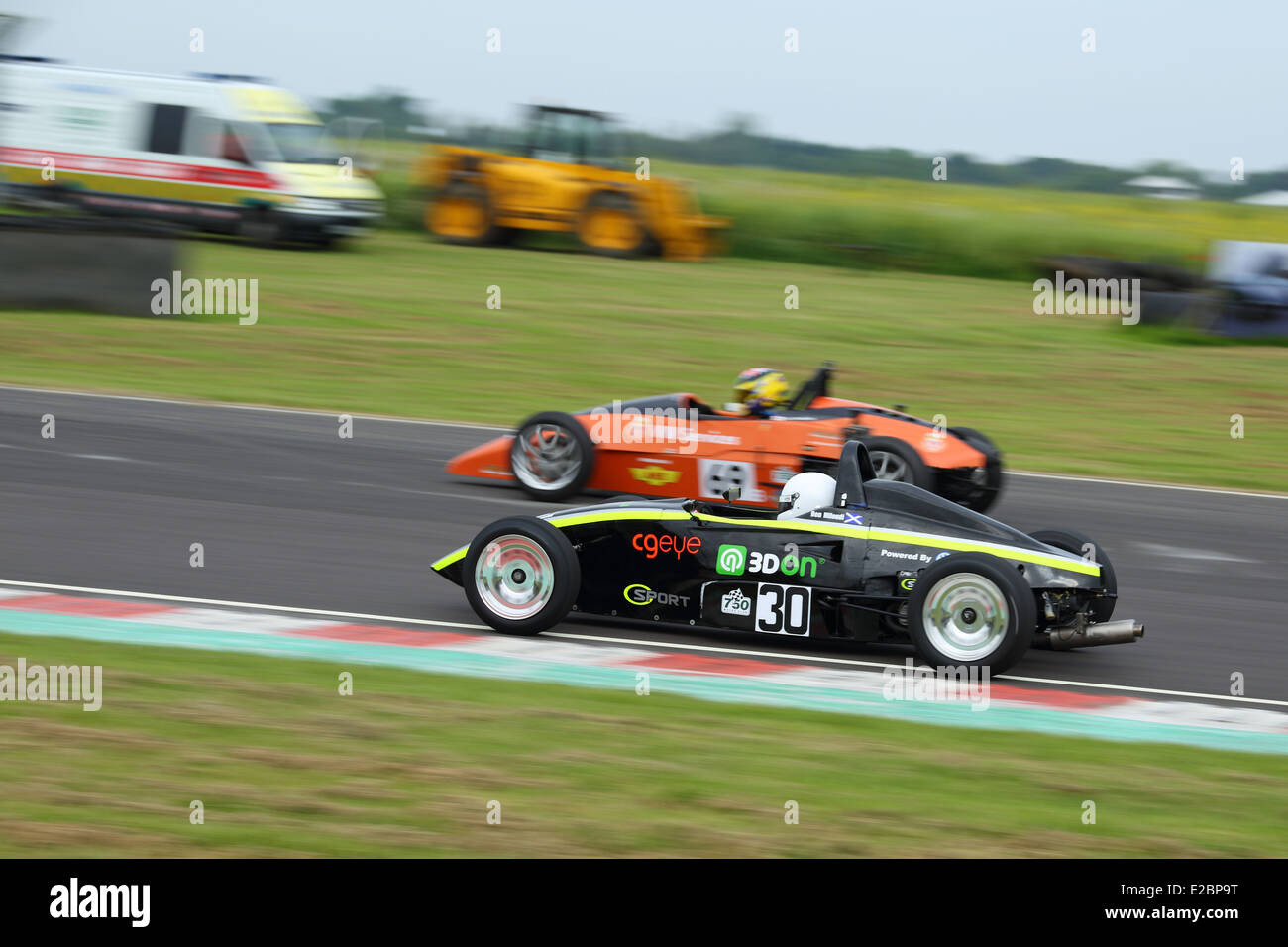 Cars racing at Castle Combe Circuit Stock Photo - Alamy