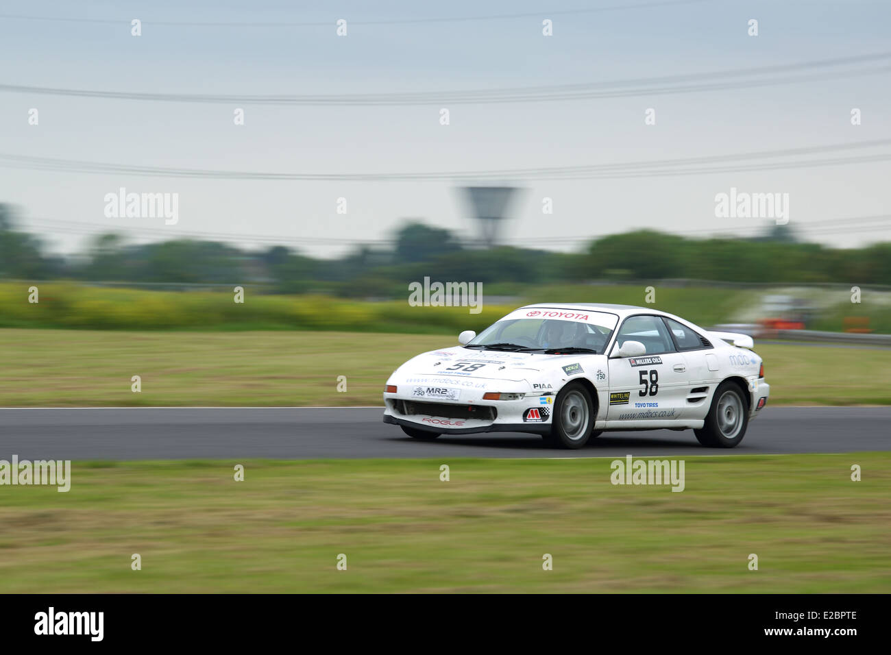 Cars racing at Castle Combe Circuit Stock Photo - Alamy