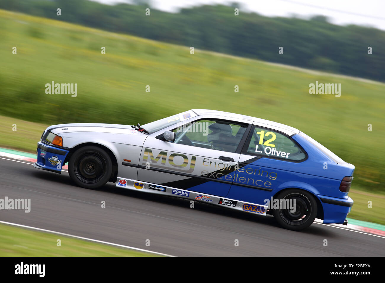 Cars racing at Castle Combe Circuit Stock Photo - Alamy