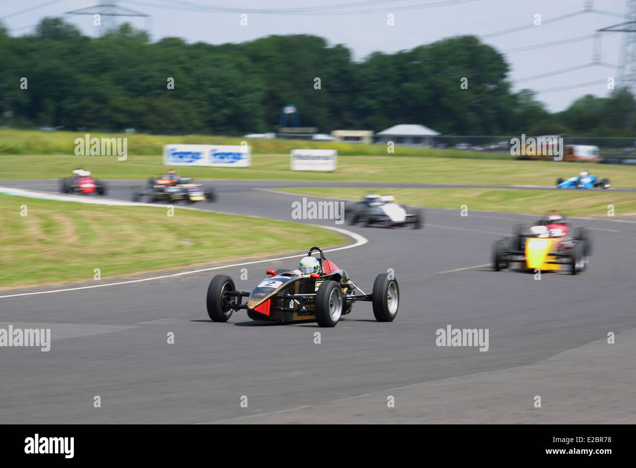Cars racing at Castle Combe Circuit Stock Photo - Alamy