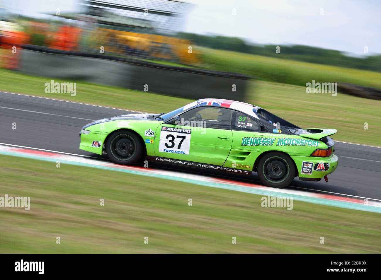 Cars racing at Castle Combe Circuit Stock Photo - Alamy