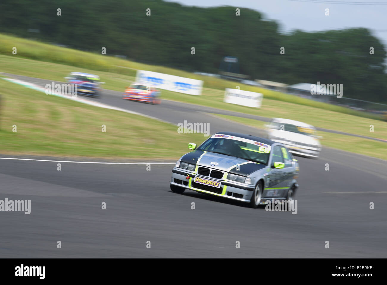 Cars racing at Castle Combe Circuit Stock Photo - Alamy