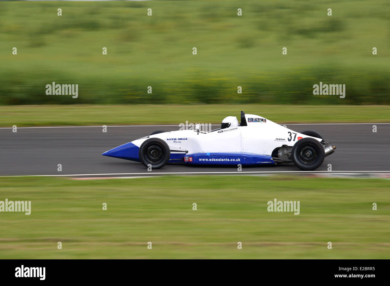 Cars racing at Castle Combe Circuit Stock Photo - Alamy