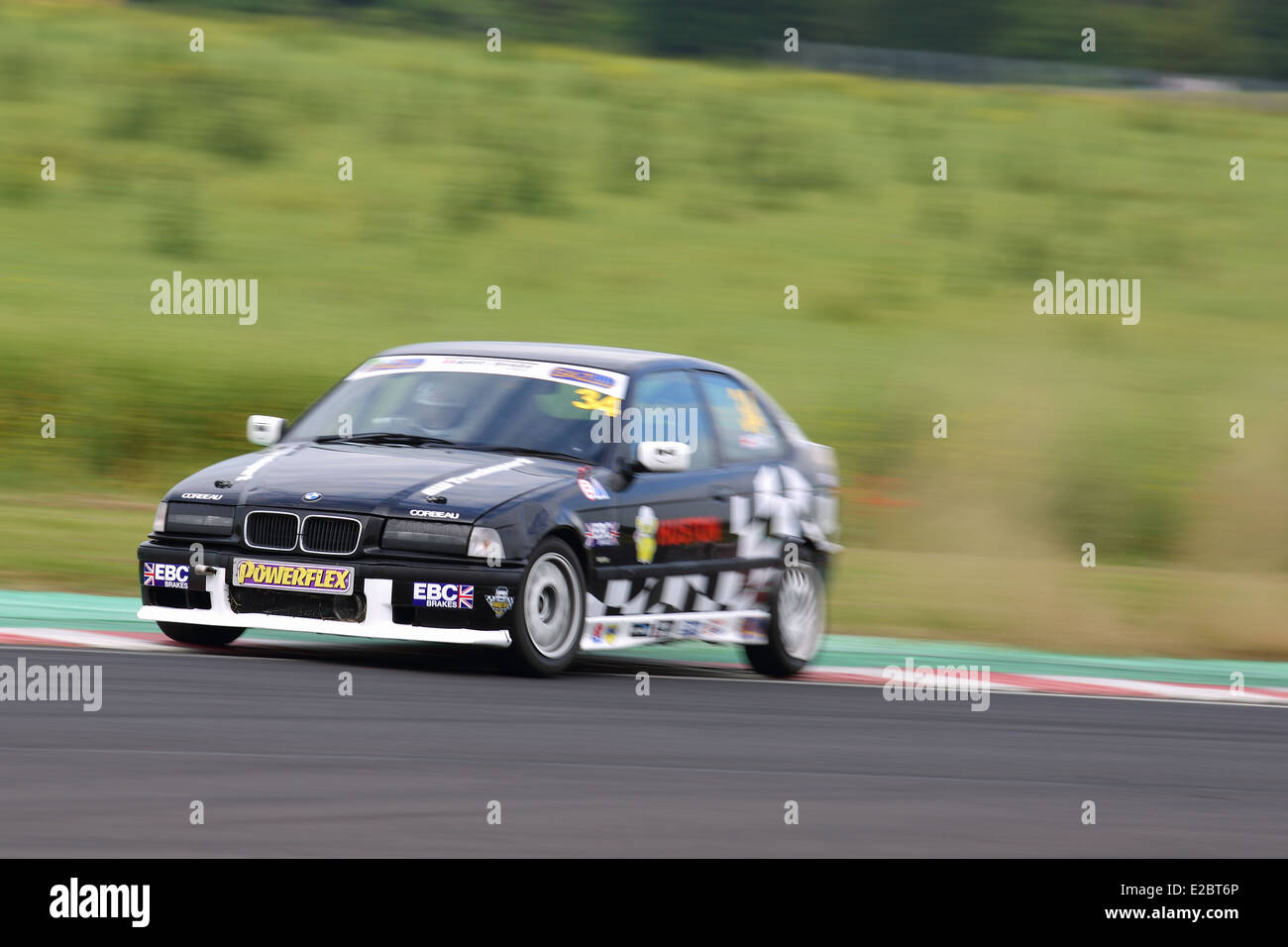 Cars racing at Castle Combe Circuit Stock Photo - Alamy