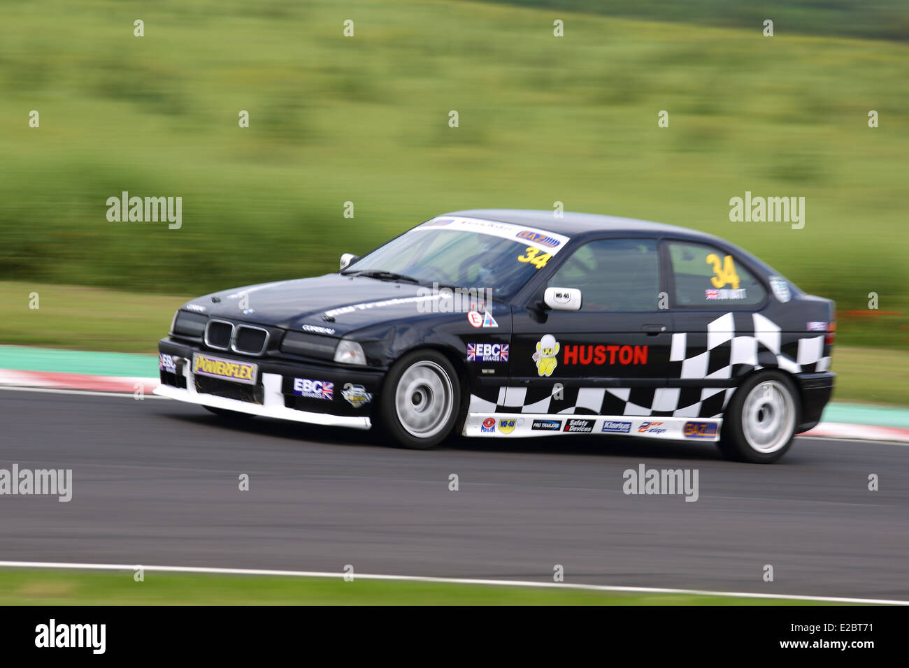 Cars racing at Castle Combe Circuit Stock Photo - Alamy