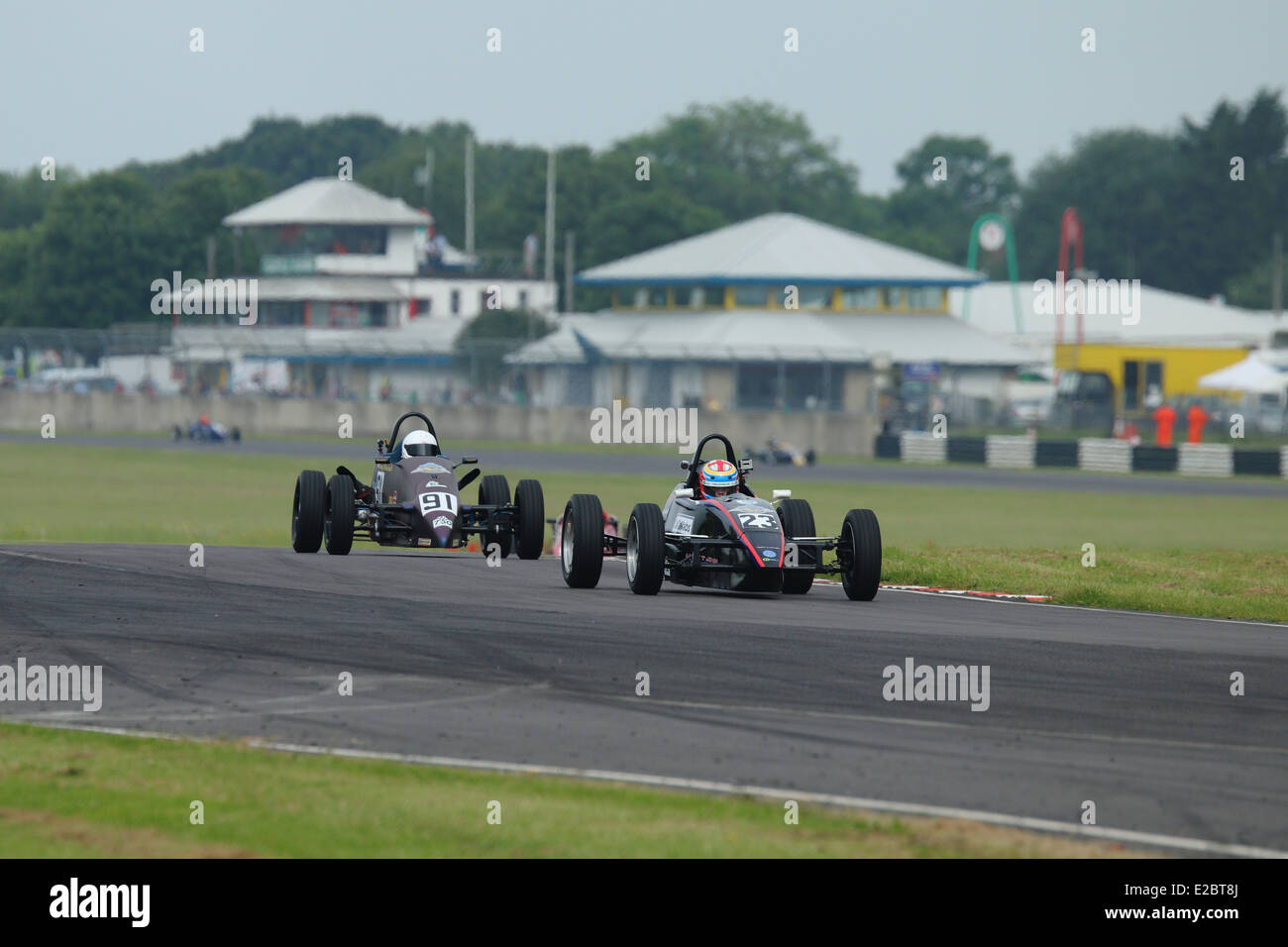 Cars racing at Castle Combe Circuit Stock Photo - Alamy