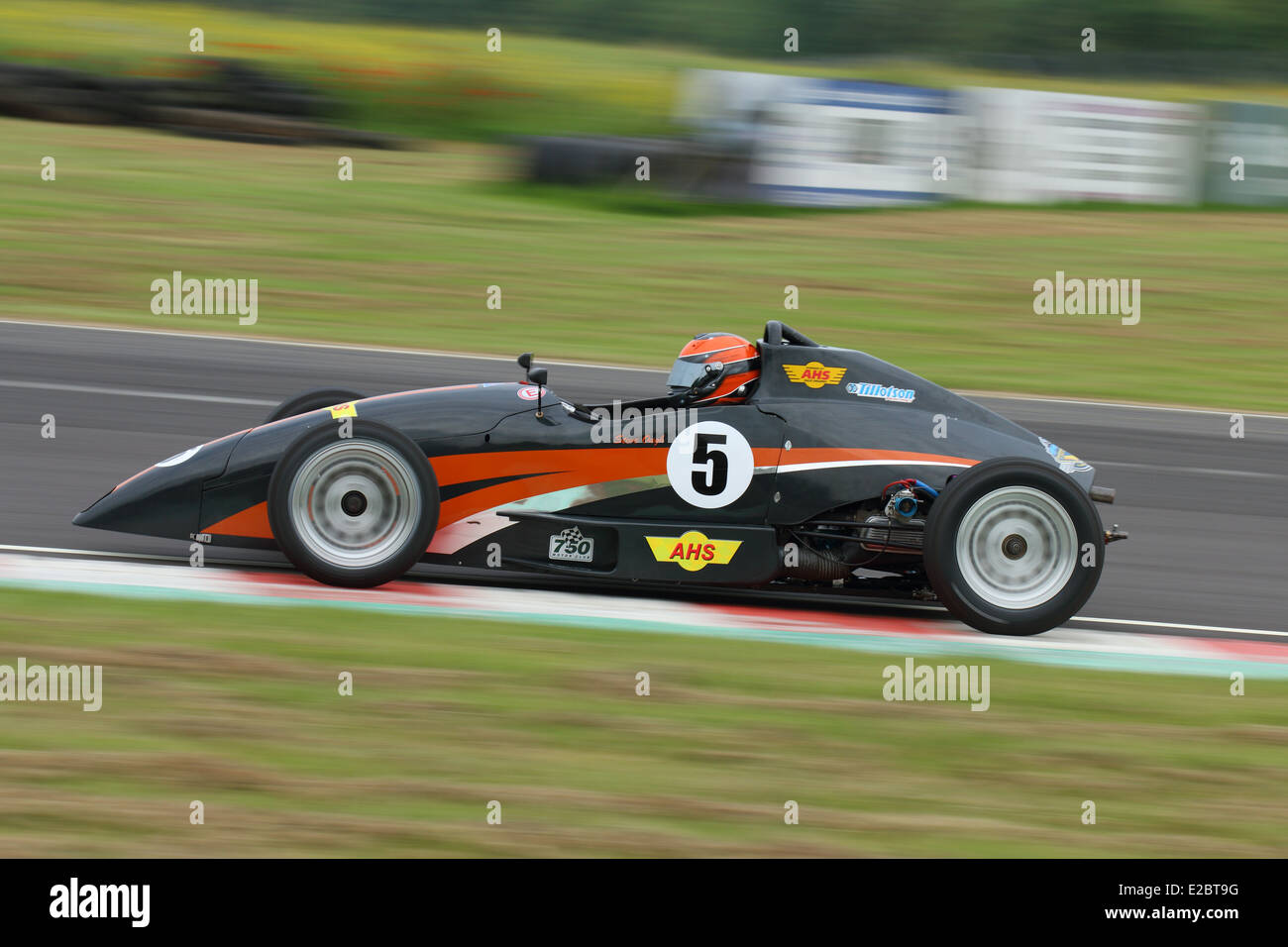 Cars racing at Castle Combe Circuit Stock Photo - Alamy