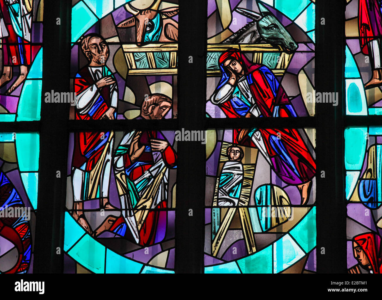 Stained glass window depicting a Nativity Scene in the Dom of Aachen, Germany. Stock Photo