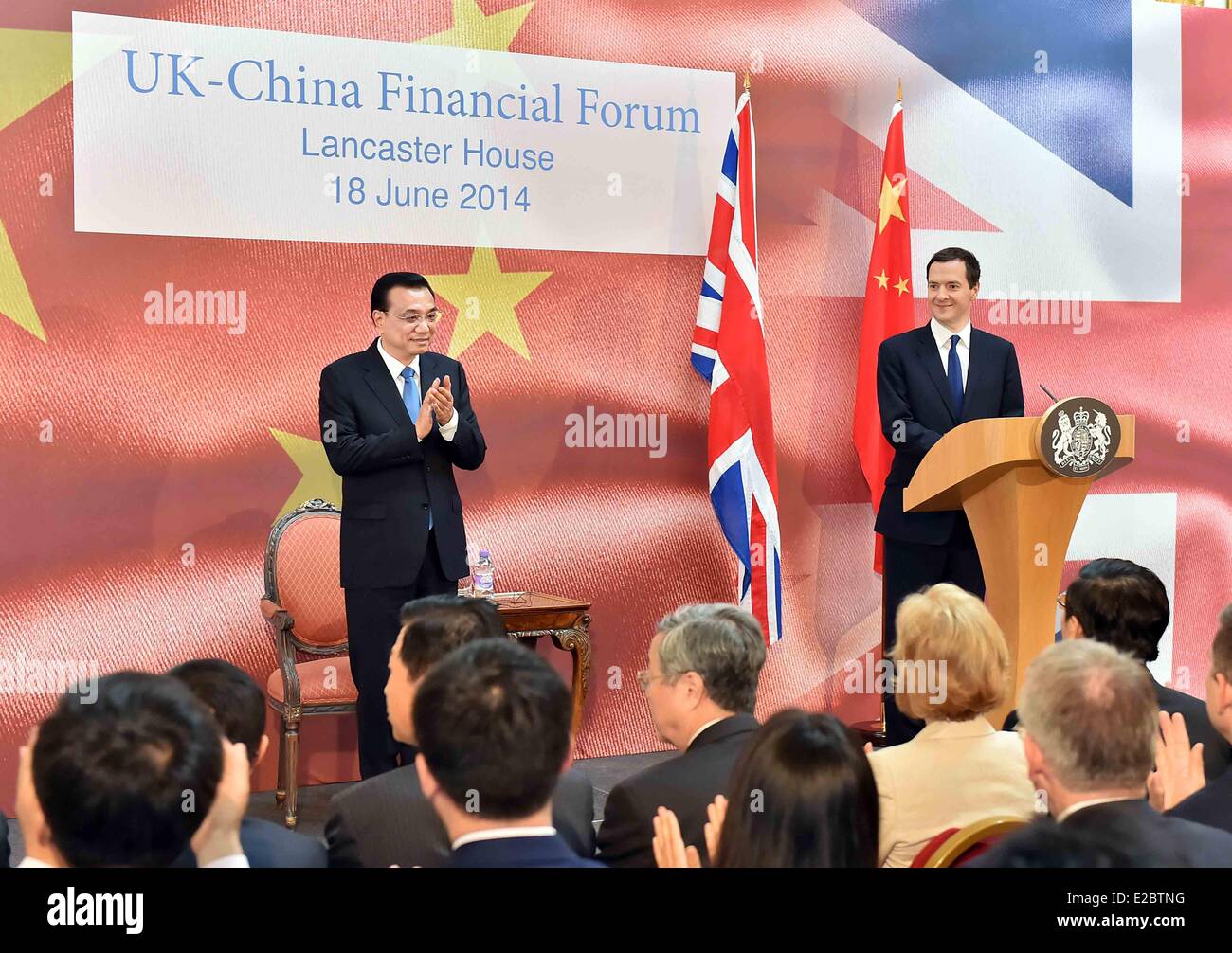London, Britain. 18th June, 2014. Chinese Premier Li Keqiang (L) and British Chancellor of the Exchequer George Osborne attend the UK-China Financial Forum in London, capital of Britain, June 18, 2014. Credit:  Li Tao/Xinhua/Alamy Live News Stock Photo