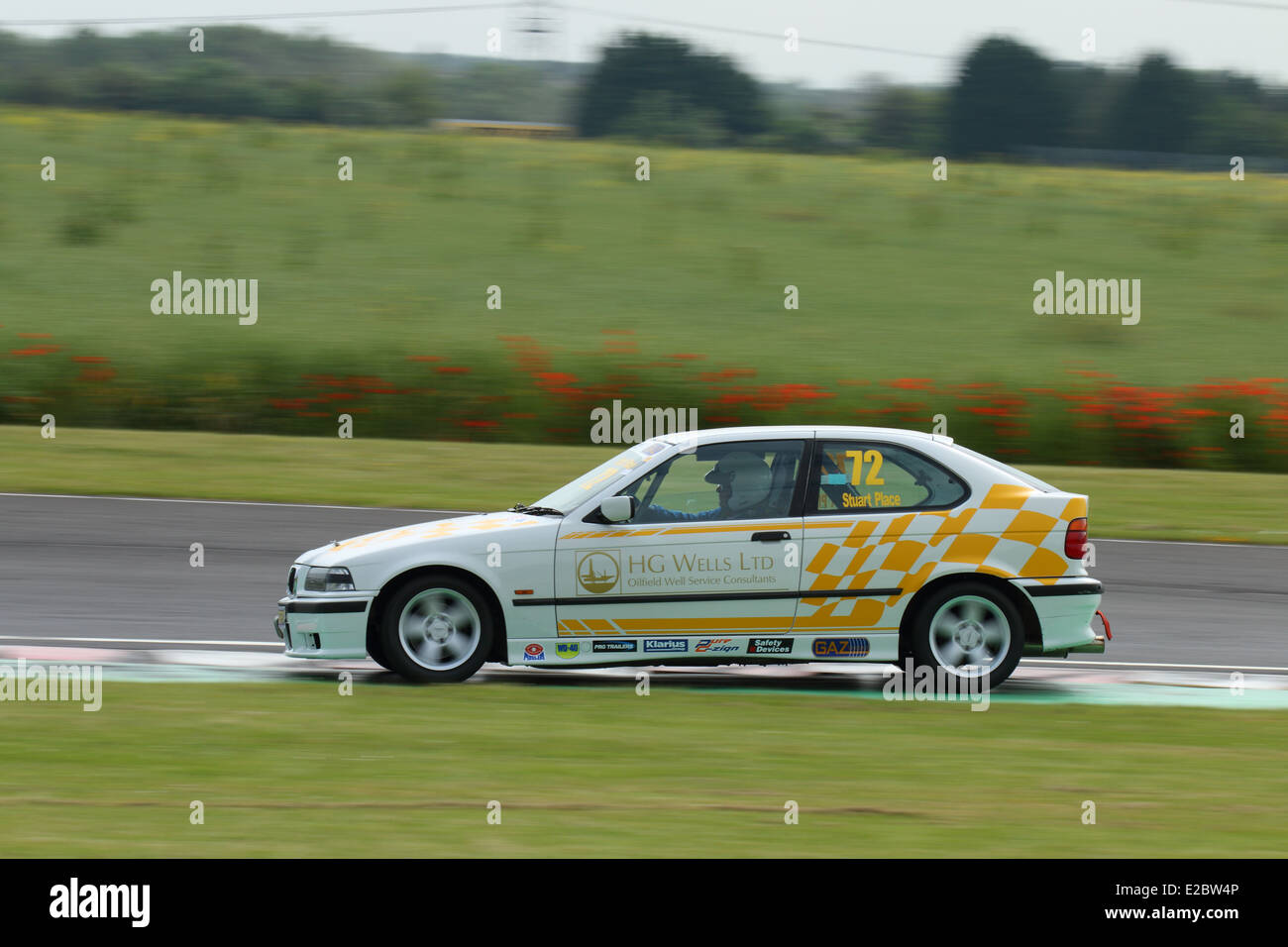 Cars racing at Castle Combe Circuit Stock Photo - Alamy