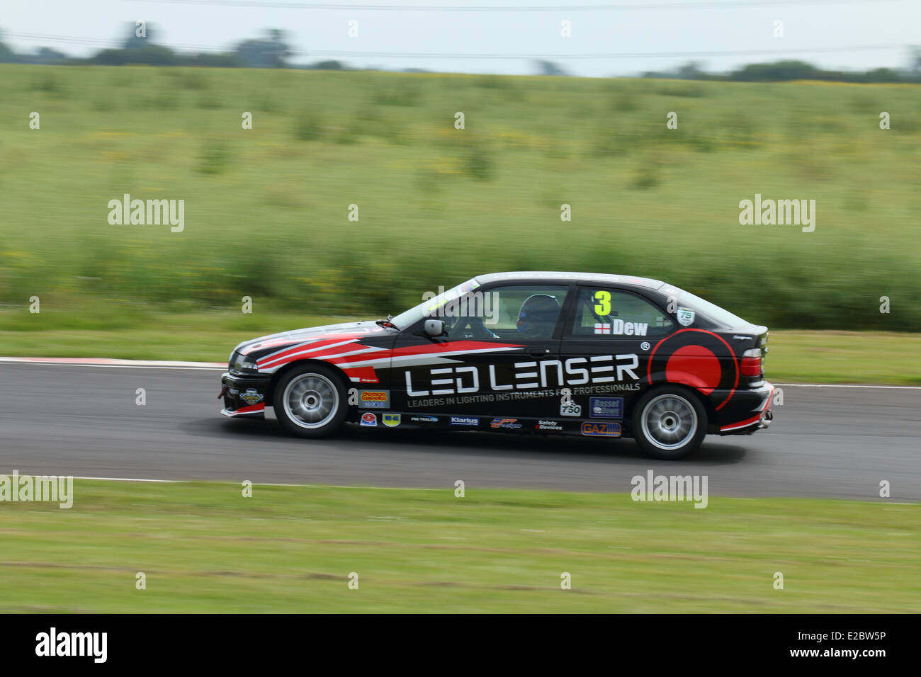 Cars racing at Castle Combe Circuit Stock Photo - Alamy