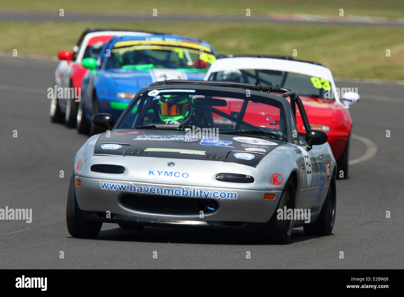 Cars racing at Castle Combe Circuit Stock Photo - Alamy