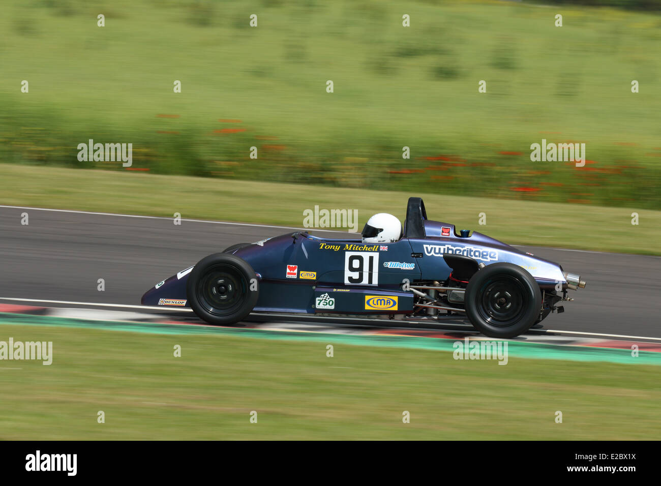 Cars racing at Castle Combe Circuit Stock Photo - Alamy