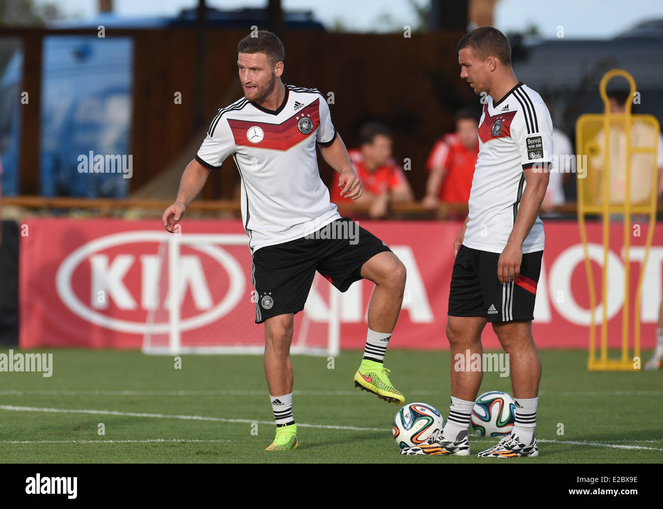 Santo Andre, Brazil. 18th June, 2014. Shkodran Mustafi (L) and Lukas Podolski in action during a training session of the German national soccer team in Santo Andre, Brazil, 18 June 2014. Photo: Andreas Gebert/dpa/Alamy Live News Stock Photo